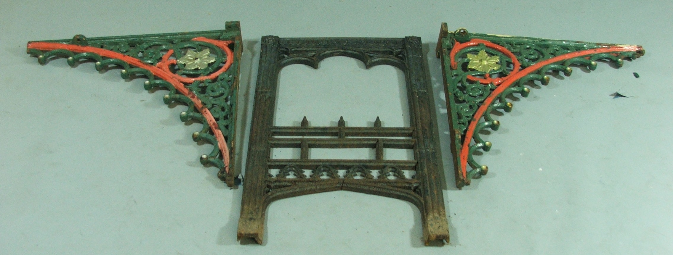 A Pair of Gothic Style Cast Iron Wall Brackets, 60 cm x 60 cm together with a Gothic Style Fire