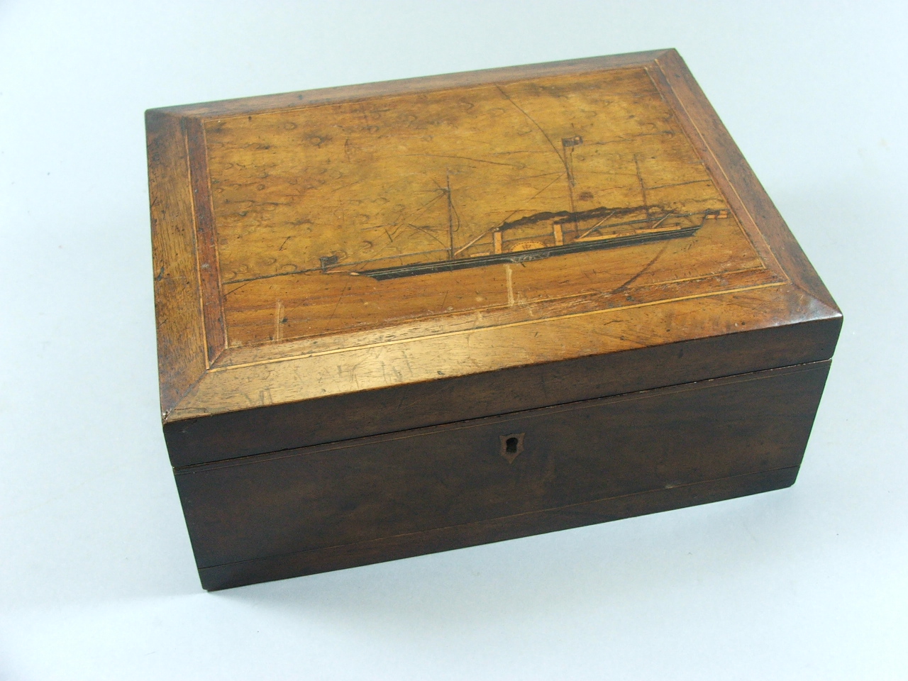 A Late 19th Century Rectangular Workbox, the Lifting Top Decorated with Inlaid Paddle Steamer to