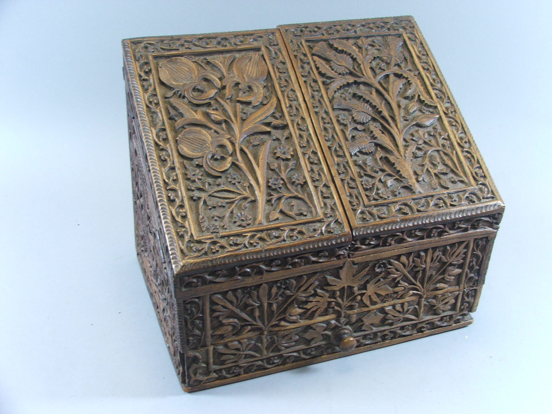 An Intricately Carved Colonial Style Stationery Box with Base Drawer, 33 cm x 23 cm x 27.5 cm High.