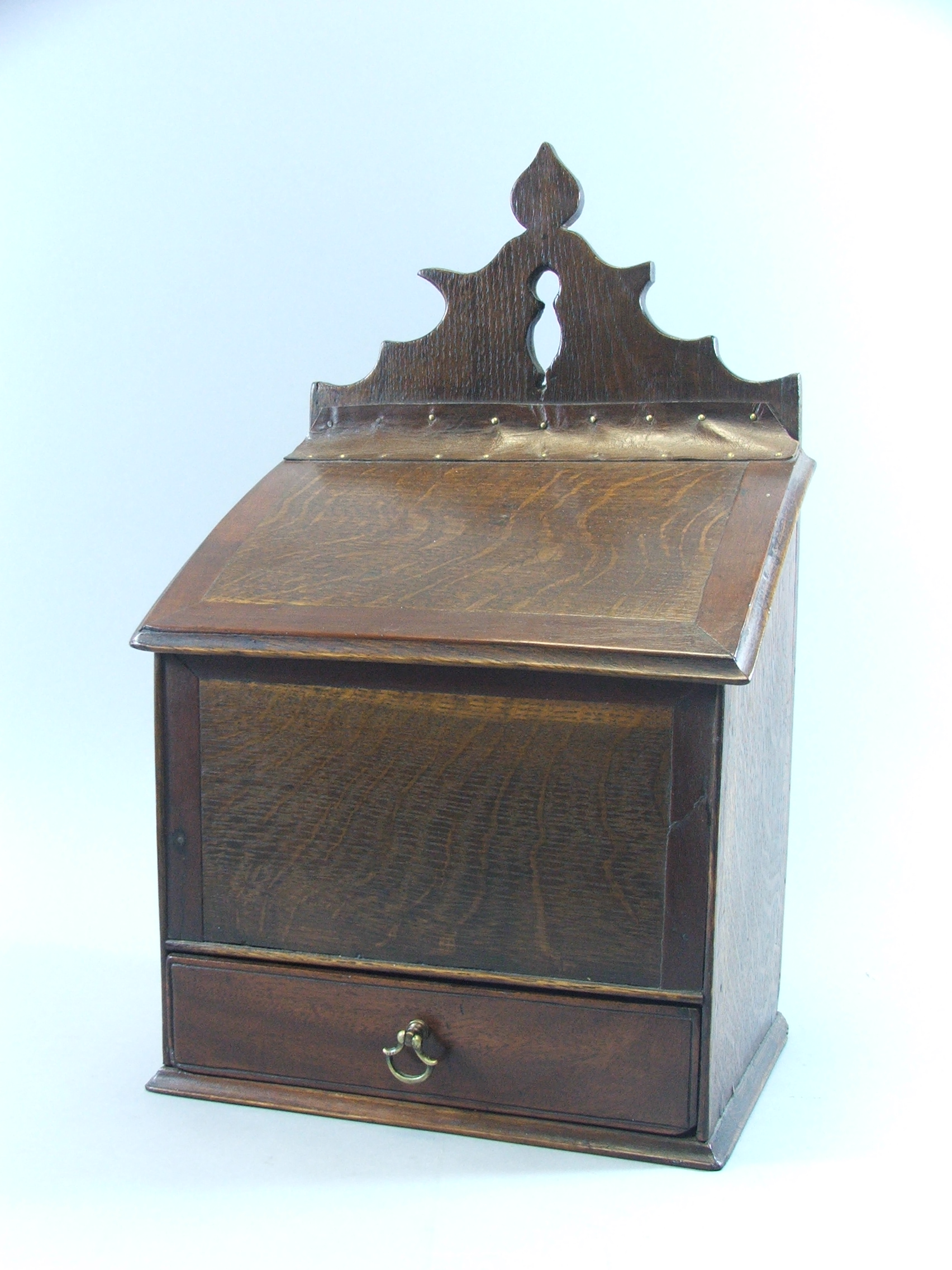 A 19th Century Oak Candle Box having Crossbanded Leather Hinged Lid, Base Drawer, 43 cm High.