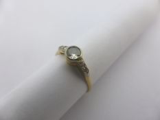A lady`s 18 ct yellow gold and platinum five stone diamond ring, 4 x 1.5 pts. eight cut, centre