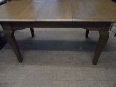 Old Charm Elm Extending Dining Table on Cabriole legs with loose leaf.