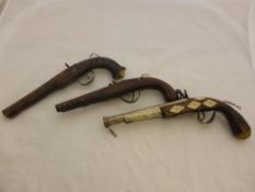 Antique Indian Pistols, two flint lock pistols and one percussion pistol.