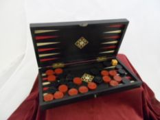 Backgammon and Chess Set; Ebony and Ivory Inlay Travelling Set. 28 x 28 cms opened.