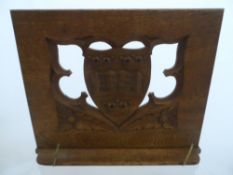 Carved Oak Book Rest depicting a University Shield.