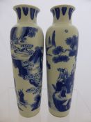 Pair of Chinese Blue and White Pillar Vases, the vases depicting pilgrims on a mountain road,