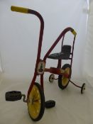 A Childs Raleigh `Chippy` tricycle.