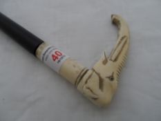 Antique Ebony and Carved Ivory Walking Cane, the handle in the form of a elephant having ebony