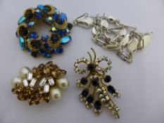 Collection of Miscellaneous Items including three brooches and a silver metal necklace.