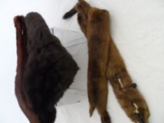 Lady’s Fur Stole together with a double mink stole and a red fur collar.