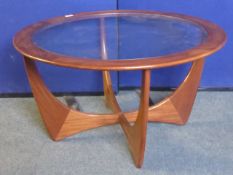 G-Plan circular rosewood coffee table, the table features a central glass top. 84 x 46 cms.