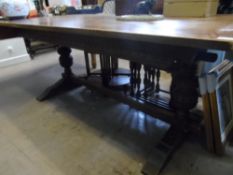 Reproduction Oak Dining Table, with bulbous ornately carved supports on splayed feet and central