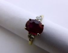 18 ct Yellow Gold Three Stone Ruby Ring, the ruby of good colour, 8 x 6 mm mounted with diamonds