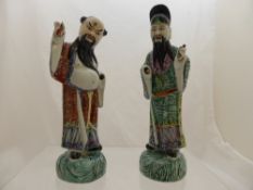 Two Chinese porcelain figures, Famille rose style, approx. 24 cms. high (waf)