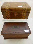 A mahogany inlaid stationery box having two inlaid panels and a central cartouche together with