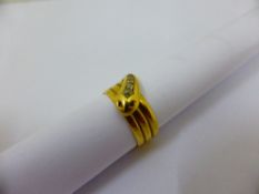 A gent`s 18 ct gold Chester hallmarked snake ring set with five graduated old cut diamonds with ruby