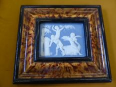 Wedgwood Style Jasper Plaque depicting cherubs at play, faux tortoiseshell frame, 11 x 9 cms.