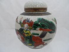 20th Century Ginger Jar and Lid, depicting Oriental figures crackle glaze ground 11 cms h.