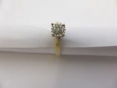 A lady`s 9 ct white and yellow gold diamond cluster ring, set with 7x 1 pt. diamonds, 3.3 gms.