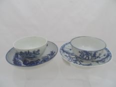 A pair of blue and white Worcester tea bowls and saucers depicting Oriental scenes. (af)