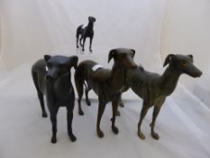 Four bronze effect metal figures of greyhounds, approx. three at 29 cms. and one at 14 cms.