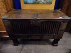 Antique Rhagastani Chest. The chest having a carved front with pierced brass corners and two