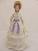 A Royal Doulton figure ‘Crinoline’.