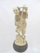 Antique Ivory Okimono (pre 1947) depicting a musician, signed to the base with an inscription to the