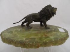 19th Century Continental Cold Bronze Study of a Lion, on a green onyx base. 22 x 12 cms h.