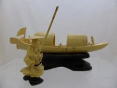 Chinese Ivory Figures of a fisherman and a Chinese Junk. (2)