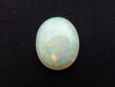 A large single milky white oval opal, 18 x 14 x 4 mm