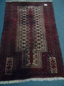 An Afghan Baluch rug approx. 5ft 2 x 3ft 5.