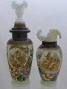 Two hand painted glass vases both having floral design, approx. 27 and 38 cms high.