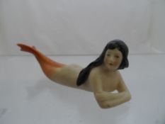 Circa 1920 Porcelain Cake Decoration depicting a mermaid.