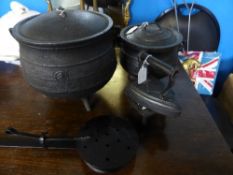 Two Cast Iron Cauldrons together with a vintage flat iron and trivet and a wrought iron chestnut