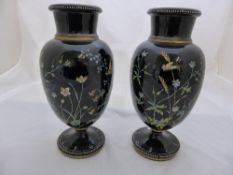 A pair of Victorian opaline vases having floral decoration and butterflies on black ground with