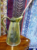 A large brass pitcher, approx. 45 cms. tall together with a copper and brass coaching horn (2)