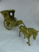 A vintage heavy brass horse and carriage, approx. 57 cms. in length