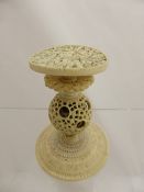 An antique hand carved Chinese ivory puzzle ball in the form of a table with finely carved top