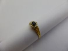 A lady`s 18 ct gold diamond and sapphire ring, 6x 1.pts eight cuts, 1.6 gms. size P, loose centre