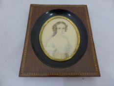 Oval Miniature Portrait of an Auburn haired girl, artist unknown, framed and glazed.