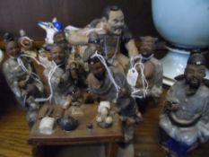 Chinese Ceramic Figures depicting various Chinese characters at work and play.