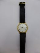 Gentleman`s gold metal and stainless steel Omega de Ville dress watch, with black leather strap,