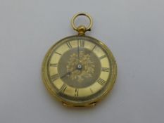 A lady`s 18ct fine gold continental pocket watch, the watch having floral engraving to the case with