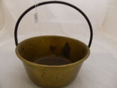 A vintage brass preserving pan having Egyptian markings and a set of scales with brass fittings