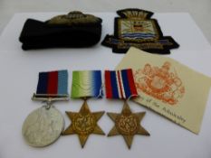 Group of three medals in a card box addressed to Mr P Robins, 30 Swiss Road, Waterlooville,
