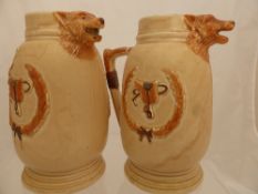 Two English Pottery Pitchers depicting the hunt, the spout featuring foxes heads.