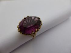 A lady`s 9 ct gold purple stone dress ring, 7.1 gms. size K