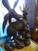 Black Forest Figure depicting an eagle and an antelope, approx. 60 x 33 x 18 cms.. (af)