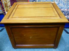 An Edwardian inlaid blanket box with sloping top.